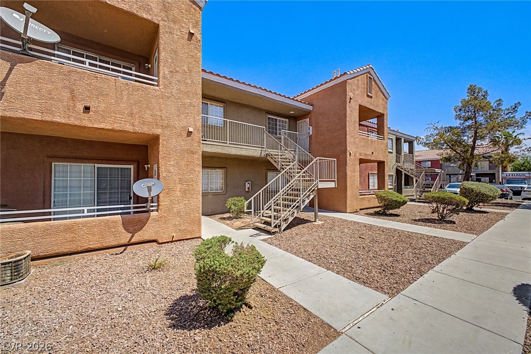 4730 East Craig Road, Unit 2096 Las Vegas, NV 89115 - Photo 2 of 35 Multi-level residential building offers private balconies and convenient exterior stair access to each unit.