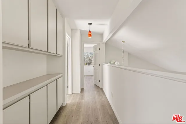 a spacious bathroom with a double vanity sink a mirror and a shower