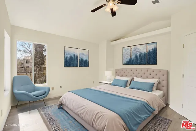 a bathroom with a double vanity sink a mirror and a bathtub