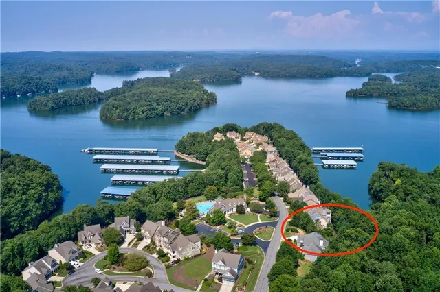 an aerial view of a house with a lake view