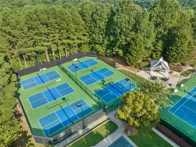 an outdoor sitting area with furniture and garden