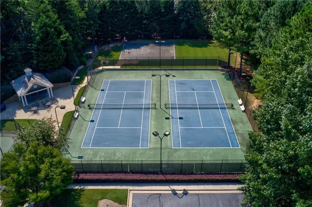 a view of a house with patio and a yard