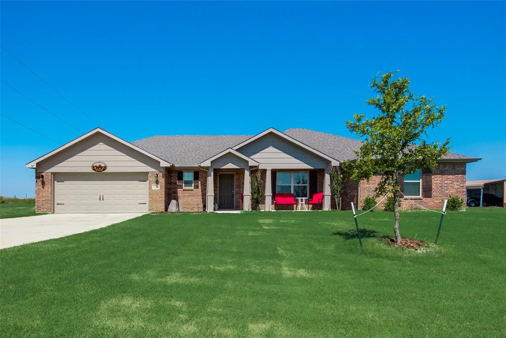 120 Hillcrest Lane Decatur, TX 76234 - Photo 1 of 1 a front view of a house with a yard and garage