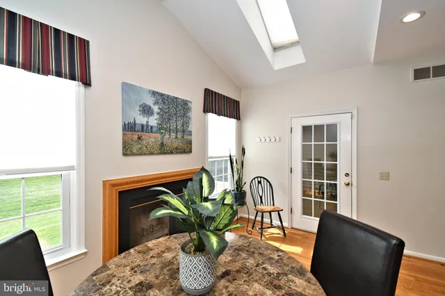 a view of a livingroom with furniture and a fireplace