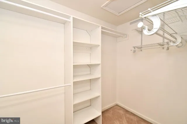 a bathroom with a double vanity sink toilet and a mirror