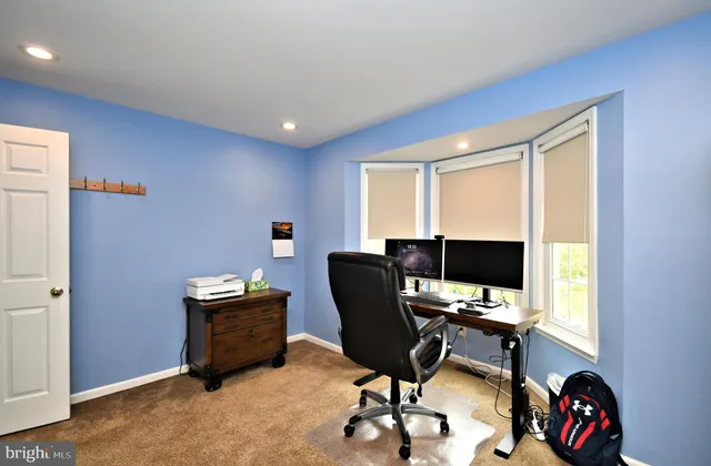 a view of empty room with wooden walls