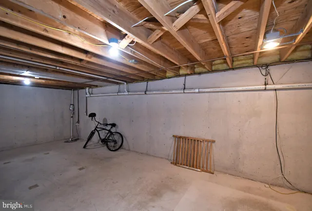 a view of a room with furniture and window