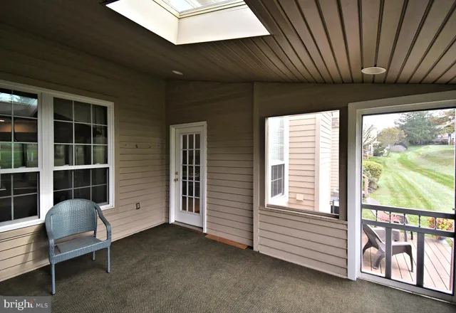 a view of a park with large trees