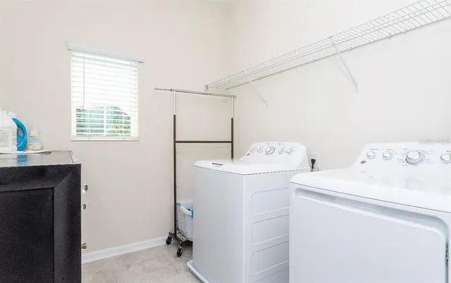 a utility room with dryer and washer