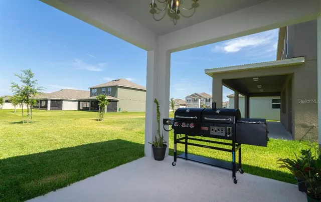 a living room with furniture and a garden