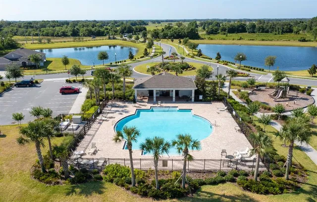 a view of a lake with a swimming pool