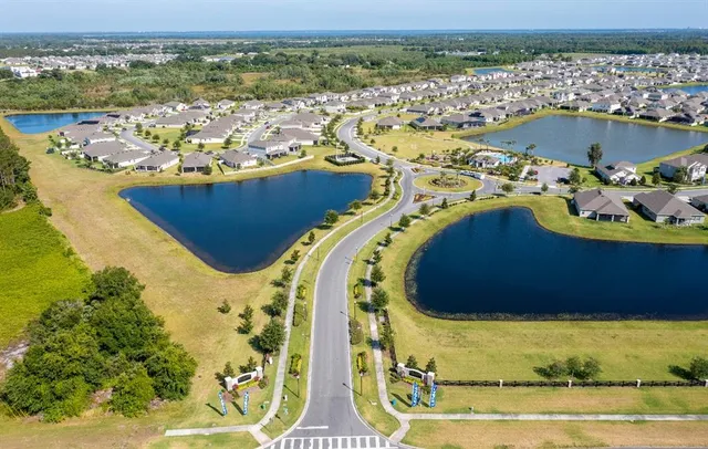 an aerial view of a house with a ocean view
