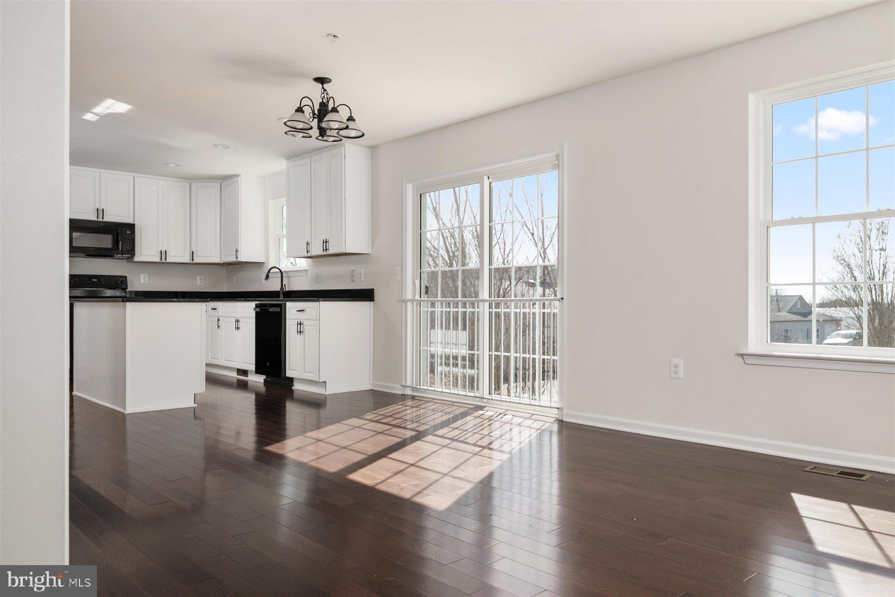 7412 Rossville Boulevard Rosedale, MD 21237 - Photo 16 of 37 a view of a kitchen with wooden floor and a window