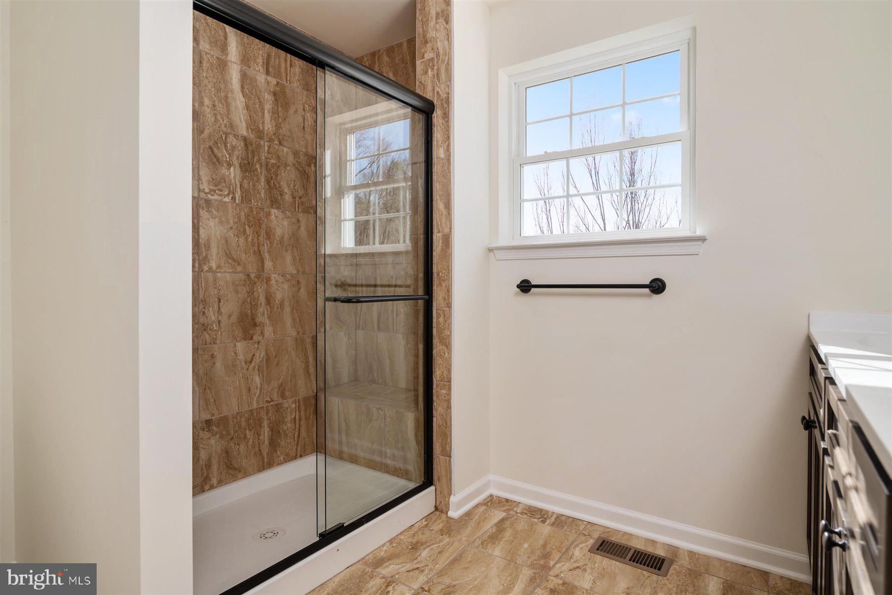 7412 Rossville Boulevard Rosedale, MD 21237 - Photo 21 of 37 a bathroom with a shower