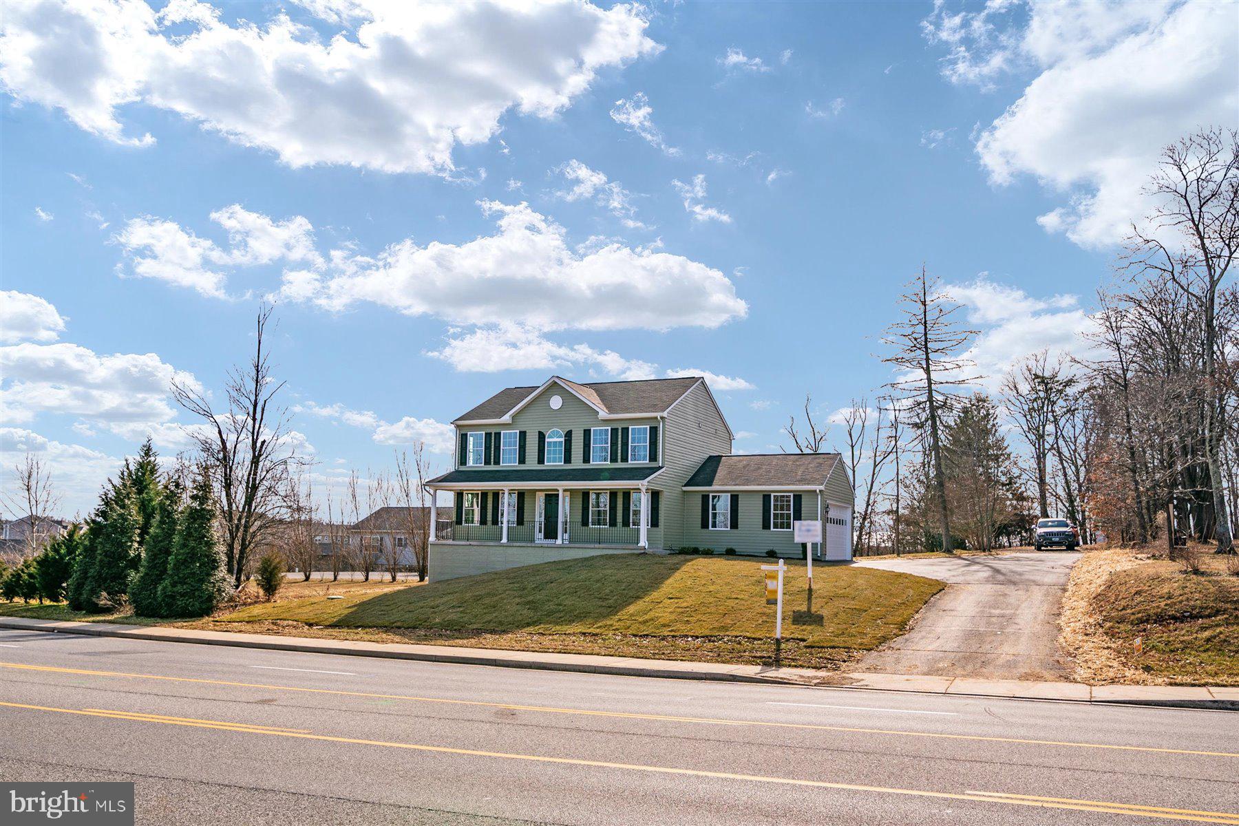 7412 Rossville Boulevard Rosedale, MD 21237 - Photo 3 of 37 a view of a white house with a yard