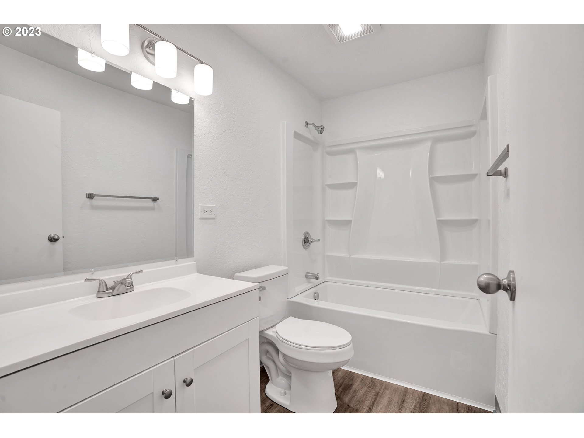 840 High Street Woodburn, OR 97071 - Photo 11 of 18 a bathroom with a sink a toilet a mirror and shower