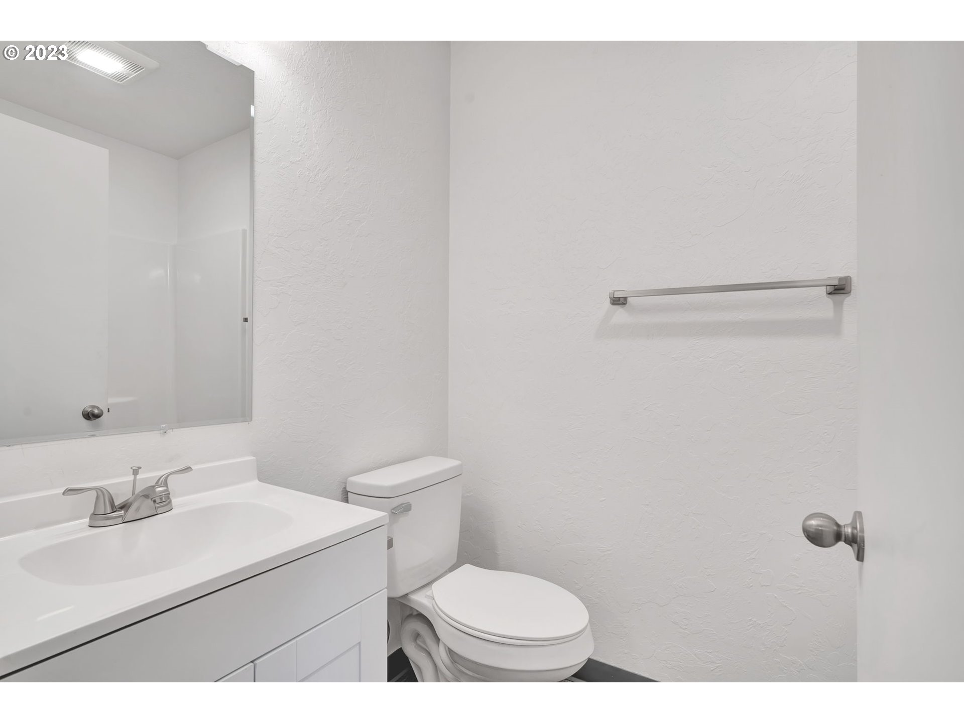 840 High Street Woodburn, OR 97071 - Photo 9 of 18 a bathroom with a sink a toilet and a mirror
