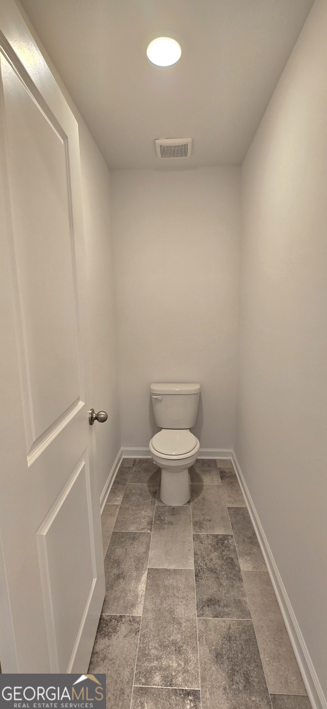 34 Russet Way Newnan, GA 30263 - Photo 23 of 38 a bathroom with a toilet and a shower