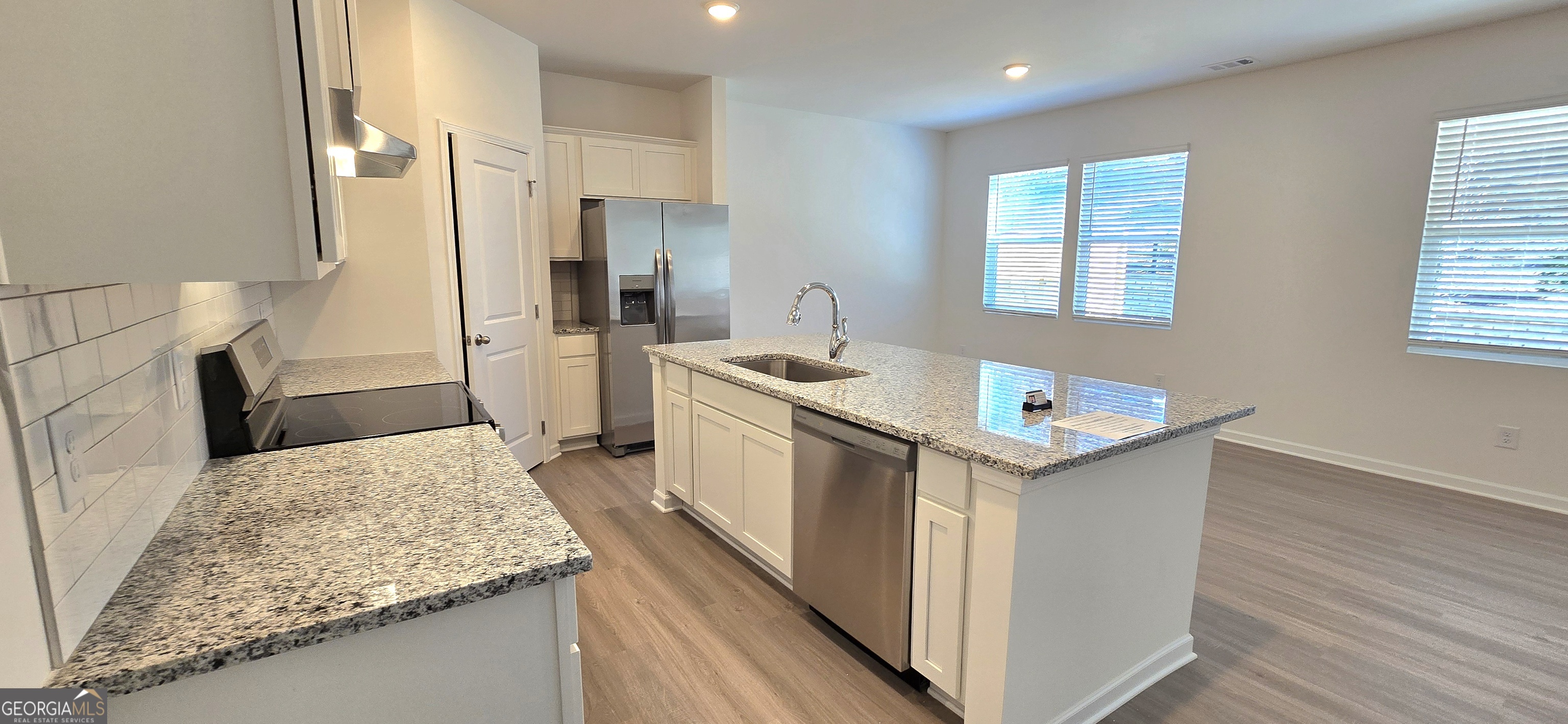 34 Russet Way Newnan, GA 30263 - Photo 9 of 38 a kitchen that has a sink in it