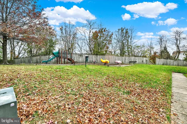 a view of a park with large trees