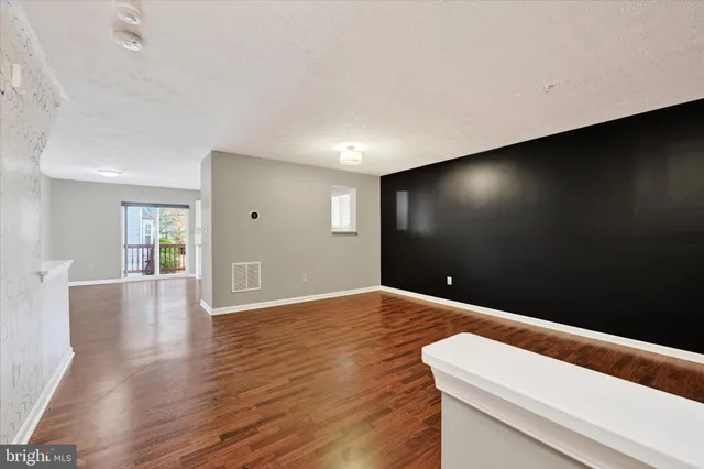 a view of livingroom with wooden floor