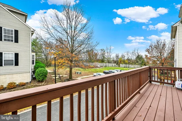 a view of a balcony with wooden floor