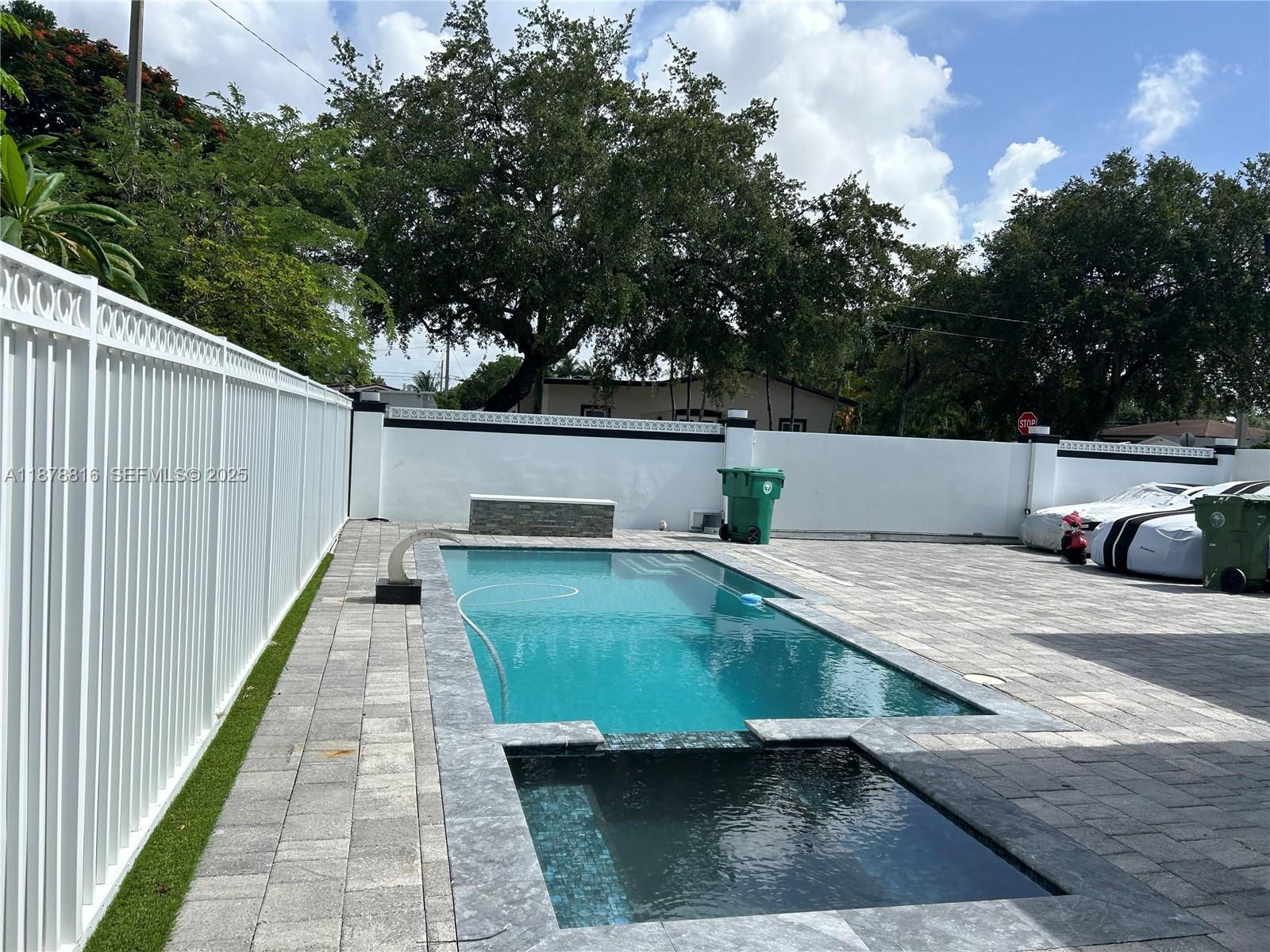 400 Southwest 47th Avenue Miami, FL 33134 - Photo 11 of 55 a view of a swimming pool with a patio