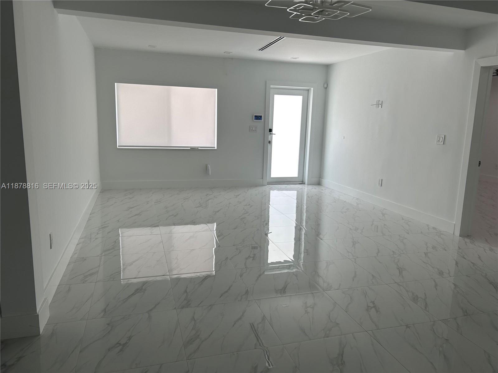 400 Southwest 47th Avenue Miami, FL 33134 - Photo 16 of 55 an empty room with windows and mirror