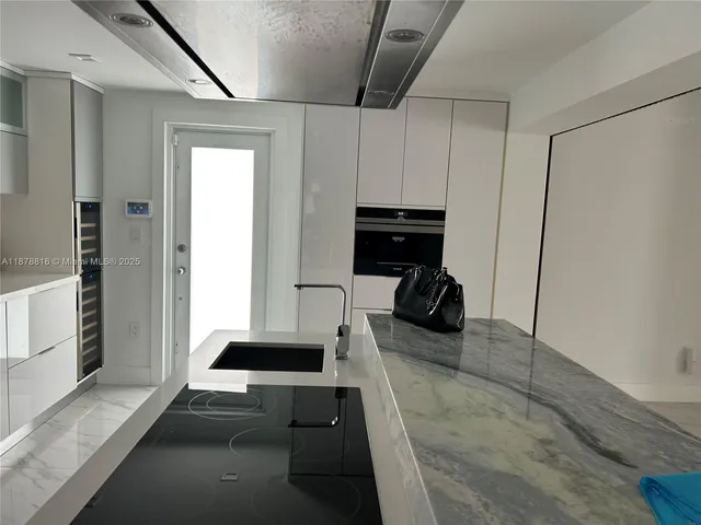 a kitchen with appliances and cabinets