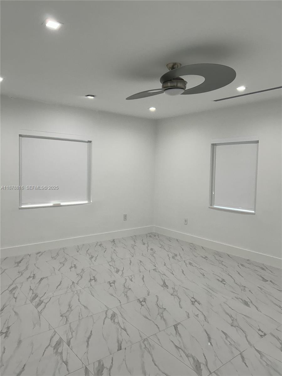 400 Southwest 47th Avenue Miami, FL 33134 - Photo 25 of 55 an empty room with a empty space and windows
