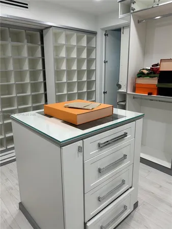 a room with a bed and a walk in closet