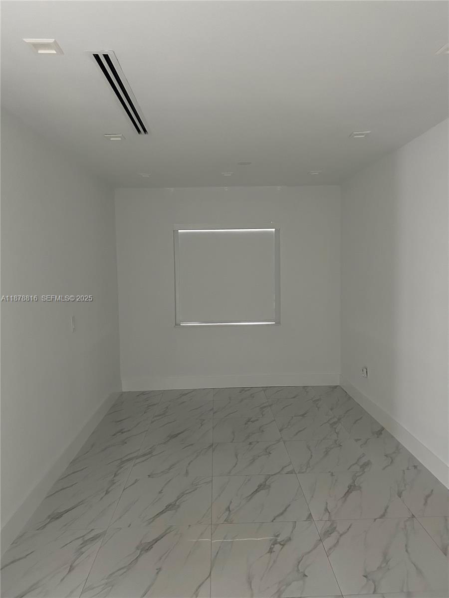400 Southwest 47th Avenue Miami, FL 33134 - Photo 37 of 55 an empty room with windows