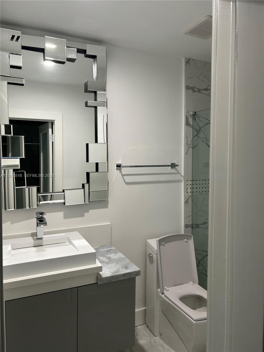 400 Southwest 47th Avenue Miami, FL 33134 - Photo 40 of 55 a bathroom with a sink a toilet and shower