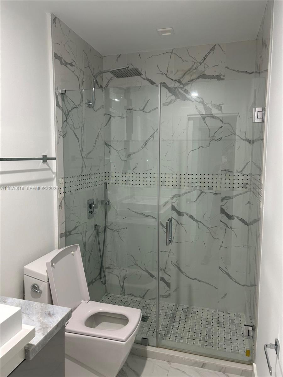 400 Southwest 47th Avenue Miami, FL 33134 - Photo 41 of 55 a white toilet sitting next to a shower