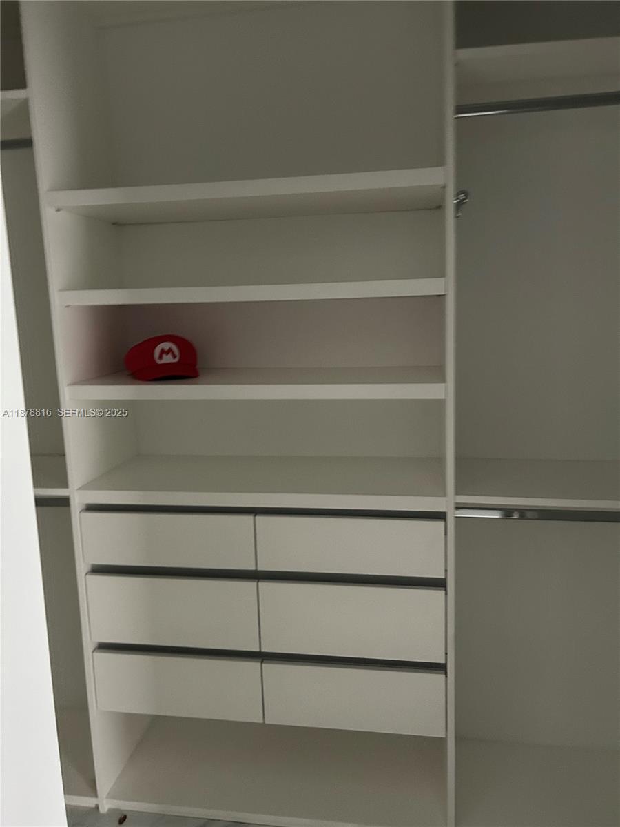 400 Southwest 47th Avenue Miami, FL 33134 - Photo 44 of 55 a view of a closet with racks on the wall