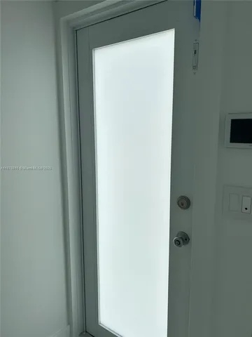 a bathroom with a shower and toilet