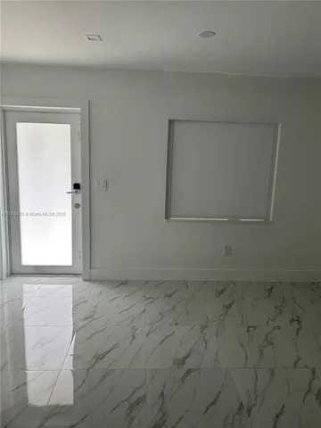 a front view of a house with a yard table and chairs