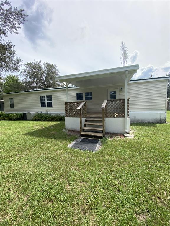 18851 Washington Lane Spring Hill, FL 34610 - Photo 12 of 25 a house view with a garden space