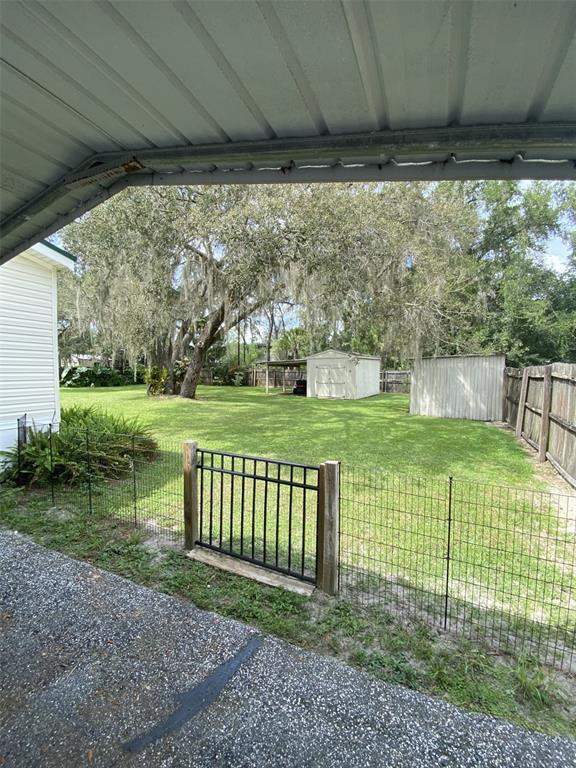 18851 Washington Lane Spring Hill, FL 34610 - Photo 15 of 25 a view of a porch with a yard