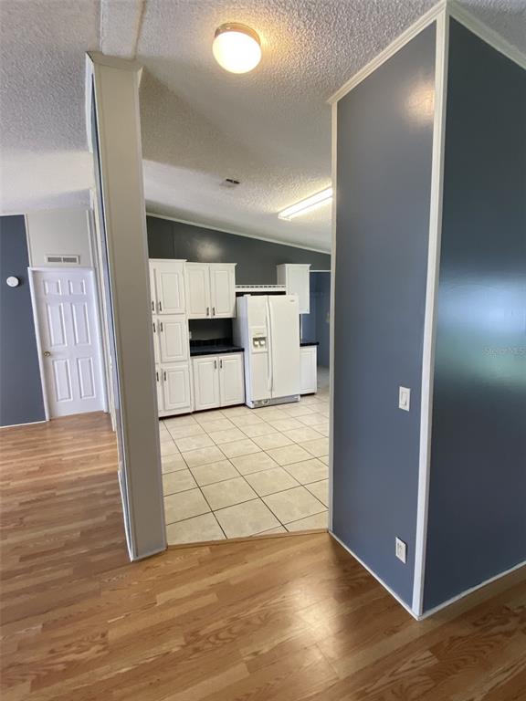 18851 Washington Lane Spring Hill, FL 34610 - Photo 16 of 25 an empty room with wooden floor and windows
