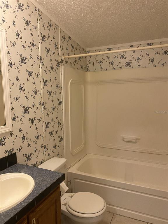 18851 Washington Lane Spring Hill, FL 34610 - Photo 22 of 25 a bathroom with a sink toilet and shower