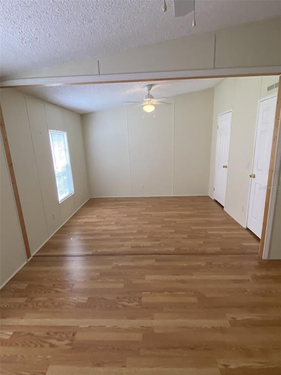 18851 Washington Lane Spring Hill, FL 34610 - Photo 25 of 25 a view of empty room with window and wooden floor