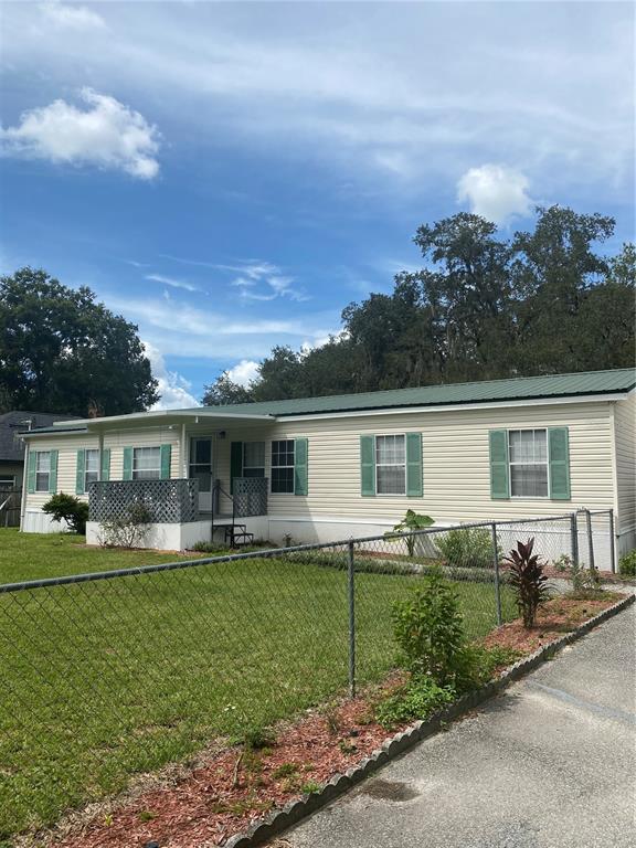 18851 Washington Lane Spring Hill, FL 34610 - Photo 3 of 25 front view of a house with a yard