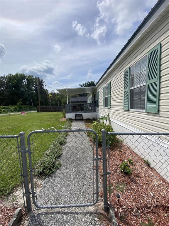 18851 Washington Lane Spring Hill, FL 34610 - Photo 5 of 25 a house view with a backyard space