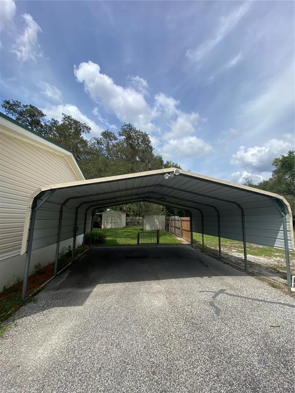 18851 Washington Lane Spring Hill, FL 34610 - Photo 6 of 25 a view of a car garage