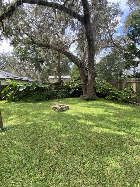 18851 Washington Lane Spring Hill, FL 34610 - Photo 9 of 25 a view of swimming pool with a yard