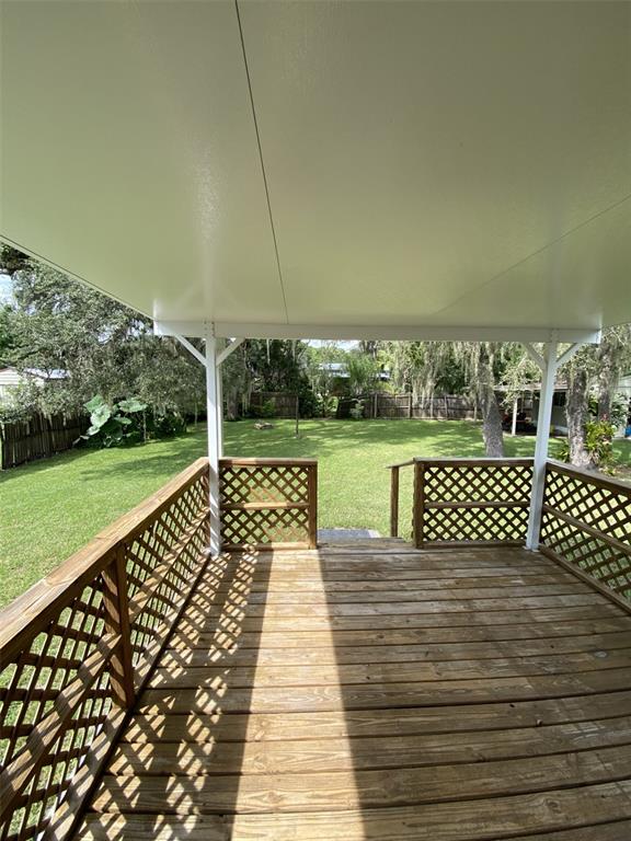 18851 Washington Lane Spring Hill, FL 34610 - Photo 10 of 25 a view of a yard with wooden fence