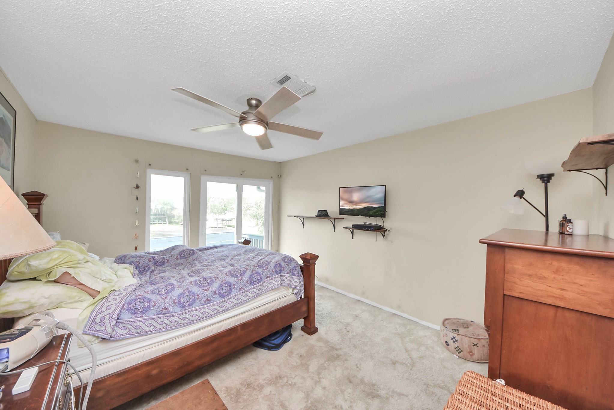2117 Casa Rio Circle Dickinson, TX 77539 - Photo 14 of 23 a bedroom with a bed dresser and a window