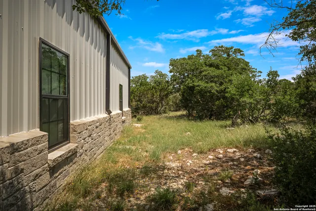 a view of backyard of house