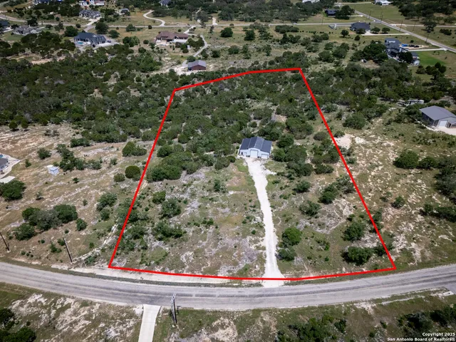 a view of a patio with a table and chairs